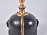 a black and gold container on a white surface