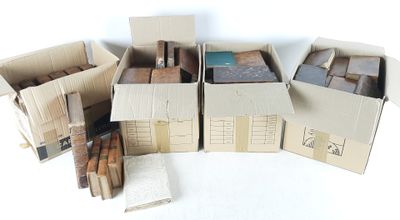 several cardboard boxes are stacked on top of each other on a white surface