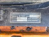 a close up of a metal plate on the back of a vehicle