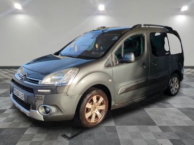 the silver van is parked on a checkered floor in a room