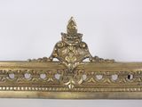 an image of a gold frame with a decorative design on it