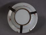 a white plate with a black stripe on it