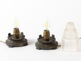 two lamps that are sitting next to each other on a table