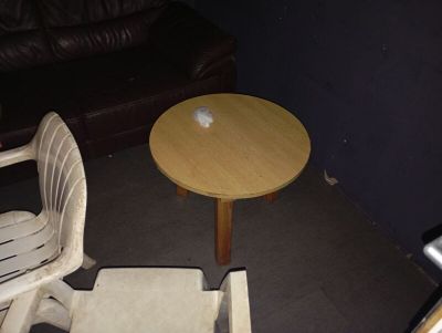 two chairs and a table in the corner of a room