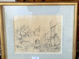 three framed drawings of a castle and a building in a room