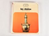 a book with a picture of a silver vase on it