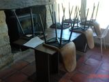 four laptops sitting on a table in front of a fireplace