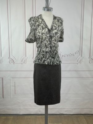 a dress on a mannequin stand in a room