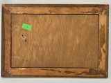 a close up of a wooden frame with a green sticker on it