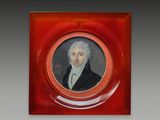portrait of a man in a red frame with a white beard