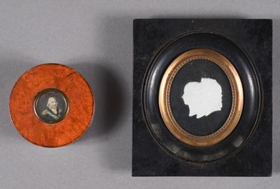 an old picture frame with a picture of a man and a woman in it