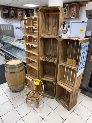 a wooden shelf in the middle of a kitchen