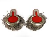 pair of red and silver earrings with fringes