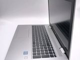 a laptop that is sitting on a white table