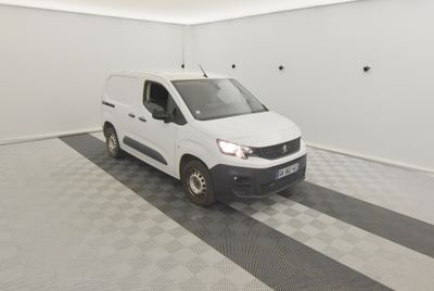 a picture of a white van parked in a garage