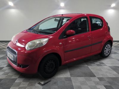 a picture of a red car parked in a garage
