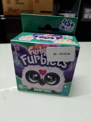 a box of fuppies on a table with a box of fuppies in the background