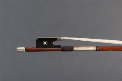 a close up of a violin bow with a wooden handle