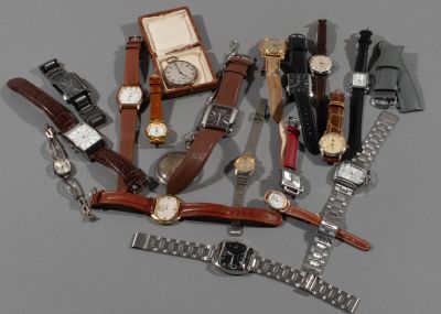 a lot of watches that are sitting on a table