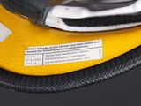 a close up of a yellow and black fire hydrant