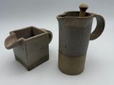 pair of vintage stoneware coffee pots with wooden handles