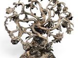 an image of a metal sculpture of a tree with birds on it