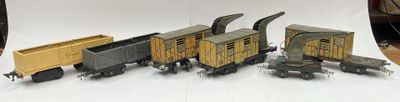 several toy trains are lined up on a white surface