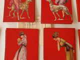six red cards with pictures of women and dogs on them