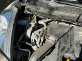 a car engine with the hood up and the hood down