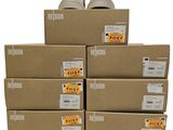 boxes of shoes are stacked on top of each other on a white surface