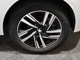 a close up of a white car with a black rim