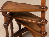 a wooden chair that has a wooden seat on top of it