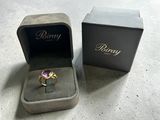 a box with a ring inside of it on a table