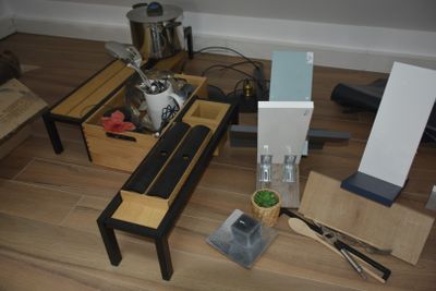 a coffee table with a tea pot and other items on it