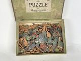 a box filled with assorted pieces of puzzle