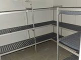 a room with bunk beds and a fan in it
