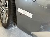 a close up of a car ' s bumper with a sticker on it