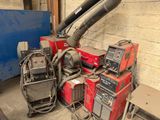 many different types of welding equipment in a garage