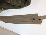 a bag and a pair of scissors on the floor
