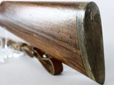a wooden object that is on a chain