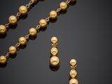a gold necklace and earring set