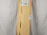 a yellow sheet that is sitting on top of a white sheet