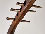 a wooden sculpture of a fish on a wooden stand