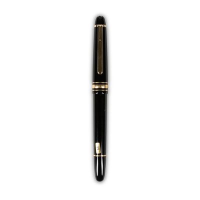a close up of a pen on a white surface with a white background