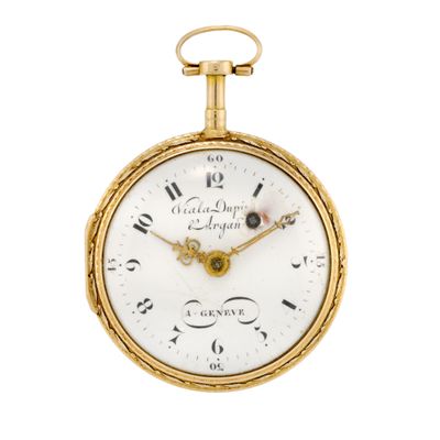 an antique gold pocket watch with roman numerals and roman numerals on the face