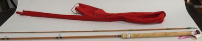 a picture of a red bow tie and a pair of fishing rods