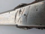 a close up of a knife with a metal handle