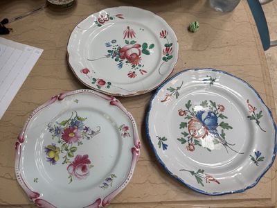three plates that are sitting on a table