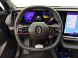 the interior of a car with a steering wheel and a touch screen