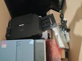 a box with a laptop, printer, and other items in it